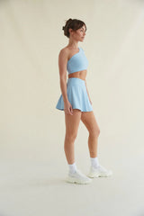Avery Smoothing Flare Tennis Skort in Blue